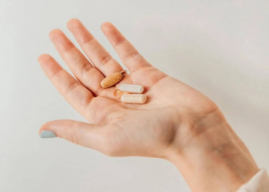 Fitness enthusiast taking supplements before workout